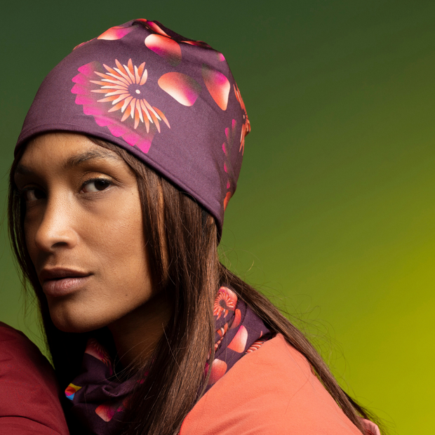 Woman wearing the new Red Sunflower Sport Beanie by Zaire for Lalita's Art Shop