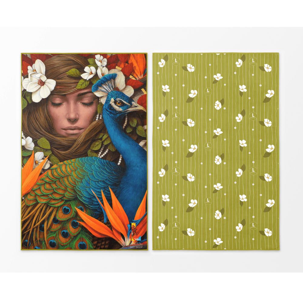 Front and back view of the Chrysalide reversible beach towel featuring a peacock and floral art on one side and a green floral pattern on the other.