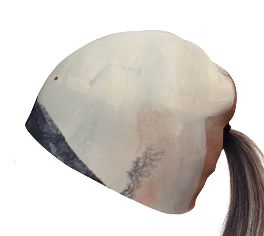 Back view of the Navy Accent Ponytail Beanie with abstract art design, showing the ponytail opening.