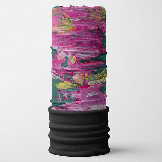 A pink, yellow, and green abstract painted design on a black fabric tube with a black ribbed bottom.