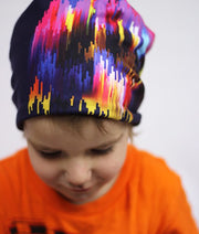 Boy wearing Lalita's Art Shop colourful Some Things You can't Explain Stroke Grow-with-me beanie. 