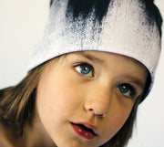 Child wearing Lalita's Art Shop Abstract Brush Stroke Grow-with-me beanie. 