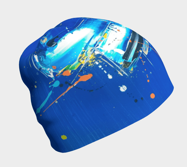right side view of the blue abstract beanie hat designed by the painter Megane Fortin.