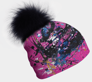 LEft side view of the vibrant, unique artwork Pink beanie hat  created by artist Megan Fortin for Lalita's Art Shop
