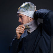Young men wearing the duo bamboo toque and  multifunctional headband, as a neck warmer, with a dark gray fall jacket. 