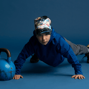 Boy doing pushups with the sports beanie by Megane Fortin