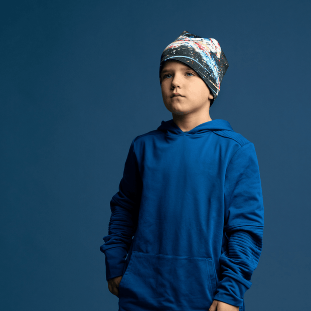 Boy with the Cheval Noir Grow-with-me beanie illustrated by Megan Fortin with a electric blue shirt