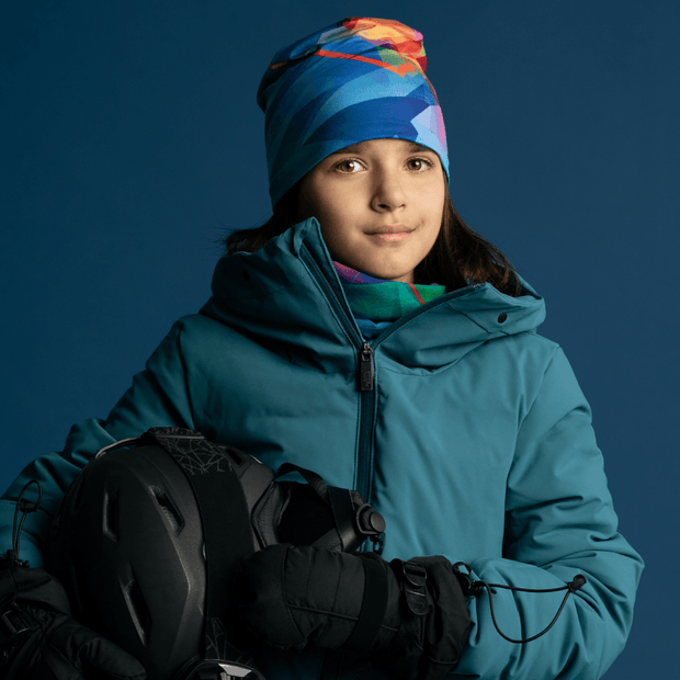  Beautiful abstract pattern children ski hats. The bamboo lining makes it so comfortable under a helmet. Like this girl, use it as a  base under your ski, bicycle or skate helmet or as a beanie, the best tuque for kids in Canada !