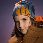 Pre-teen boy wearing the gray, black and orange beanie hat with a ochre and orange winter jacket
