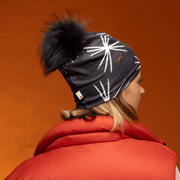 Women facing backwards wearing the MotifX Sport Beanie with Black Pompon by Valery Goulet for the Lalita's Art Shop 24 collection