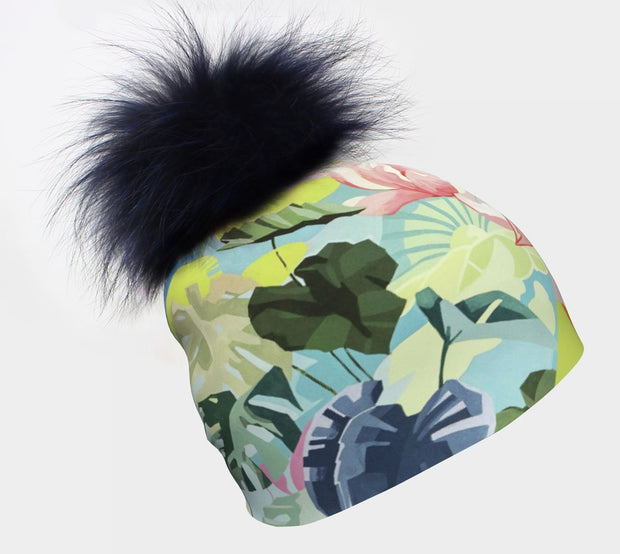 Right side view of the floral beanie with pastel colors by street artist Ankhone for Lalita's Art Shop. The navy pom is removable to give you detachable pompom is perfect for fall, winter and spring. Thanks to its removable fur pom, it’s easy to maintain!