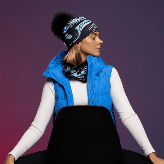 Woman wearing the Black and Blue Heron Polar tube with assorted pompom beanie by Julie Rocheleau for the Lalita&