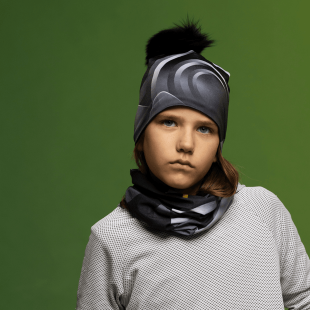 Boy wearing the Black and Gray Rockies Beanie with Black Pompom for Lalita's Art Shop