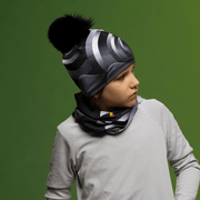 Young boy wearing the Black and Gray Rockies Beanie with Black Pompom by Zaire for the Lalita's Art Shop 24 collection