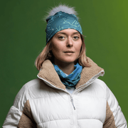 Woman wearing the Turquoise Green Bamboo beanie with Gray Pompom and assorted tube by Valery Goulet for Lalita's Art Shop